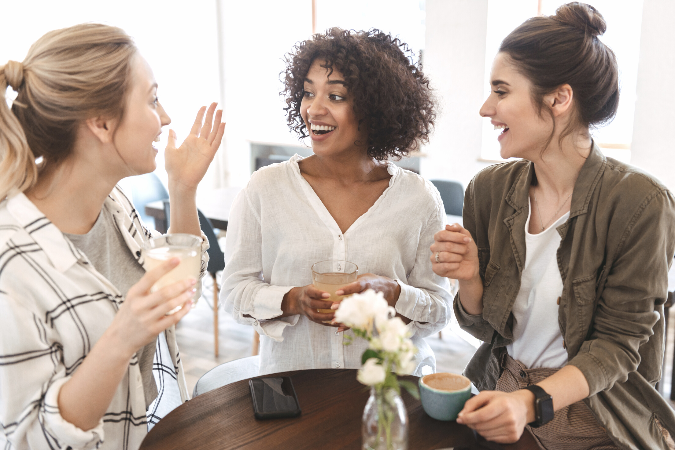 Happy Young Women Friends Having Coffee Break